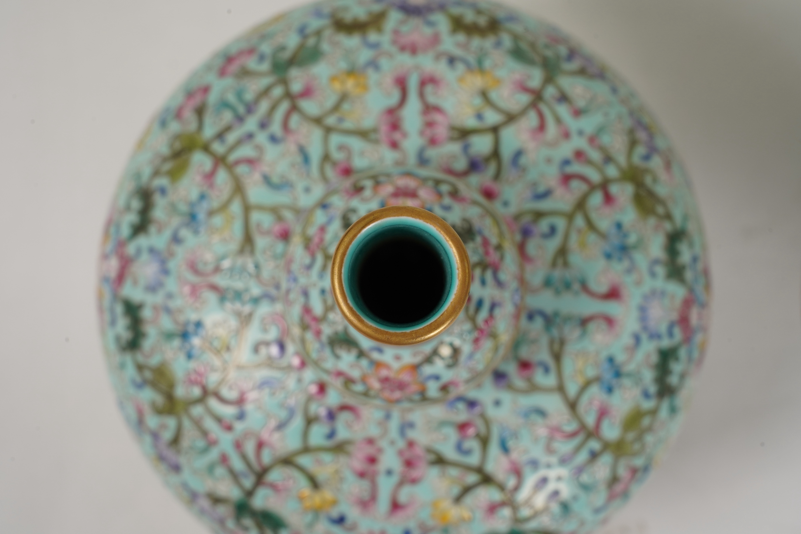 A pair of Chinese famille rose enamelled porcelain bottle vases, Qianlong seal mark to base but Republic Period
